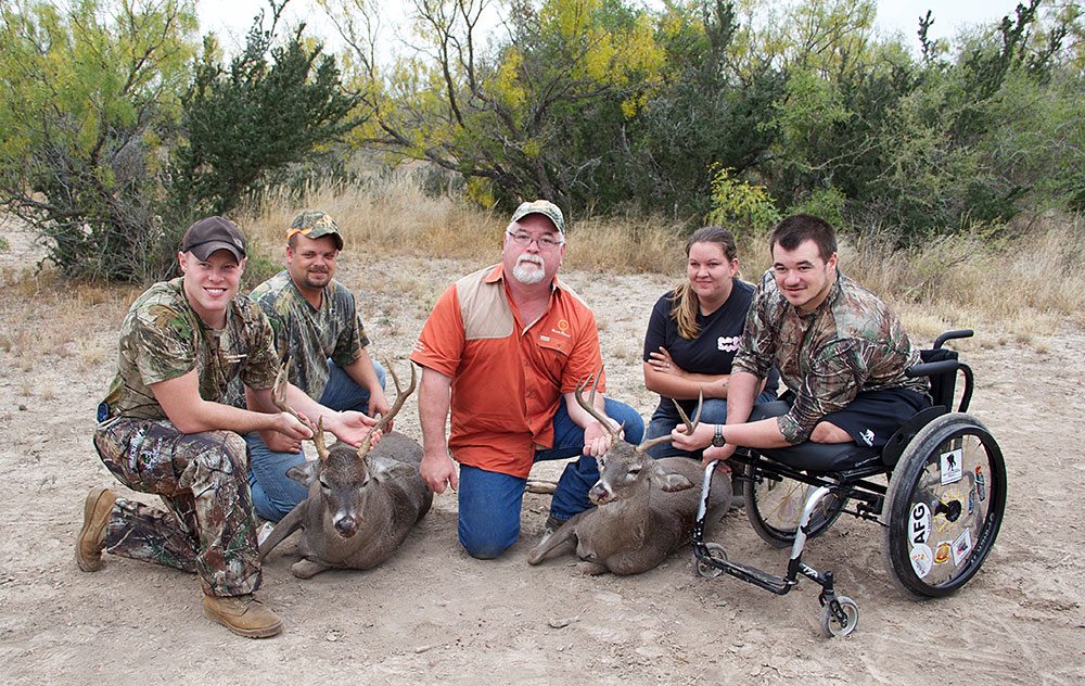 smiling group after with veterans and leader