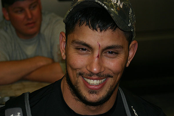 smiling man with proof of hunt on face