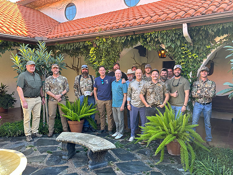 happy group photo outside of accomodations