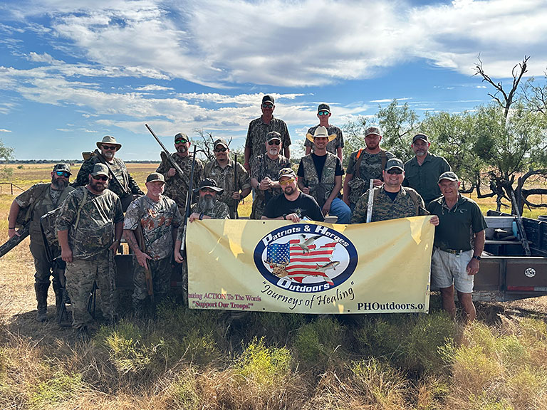 happy veterans group in the outdoors