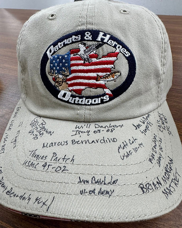 Patriots & Heroes official cap with many participant signatures