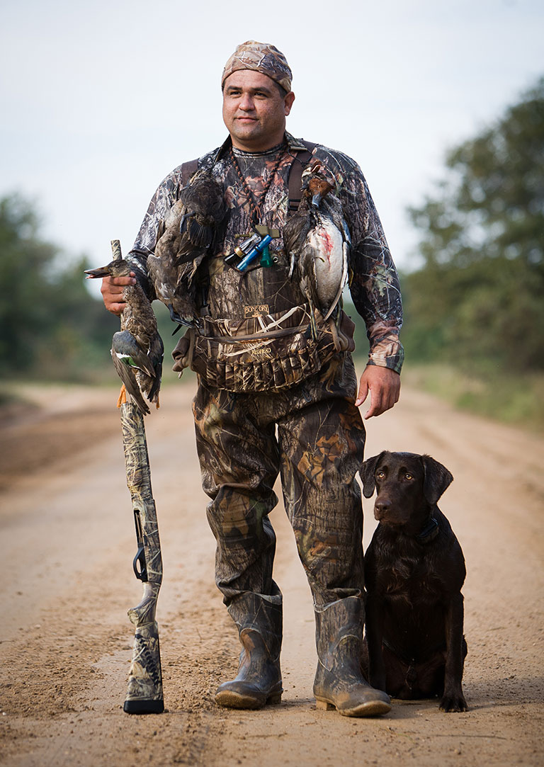 veteran with bird catch and best dog
