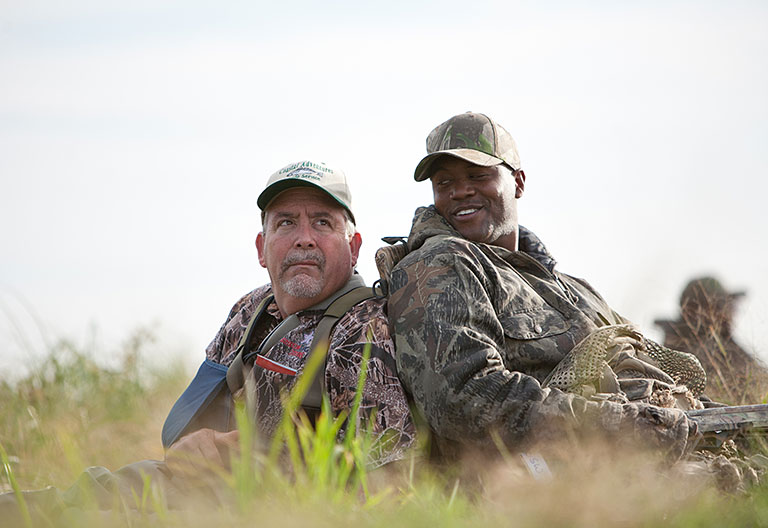 sharing the moment in action in the grass